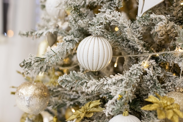 Christmas tree with a white baubles.Luxury new year decor.