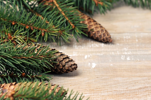 Christmas trees and cones on wooden table