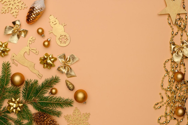 Christmas winter composition Flat lay of golden christmas decorations on beige background Christmasnew year concept