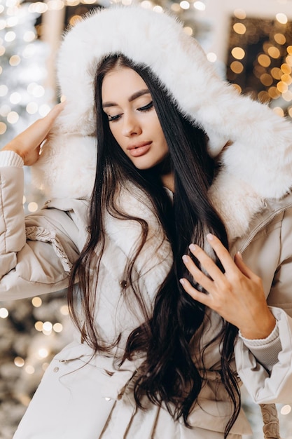 Christmas winter woman with christmas presents Fairy Beautiful Christmas and Christmas tree Festive makeup Fashion model girl