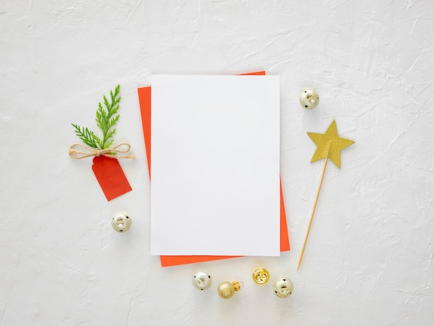 Christmas wish list or card and xmas decorations on the white background copy space mockup flat lay