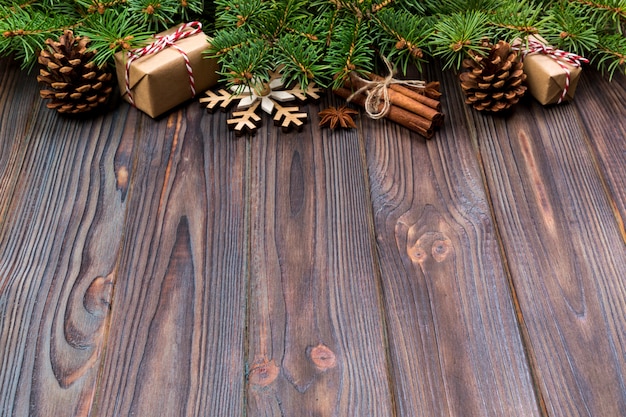 Christmas  with fir tree and gift box on wooden table, Top view  