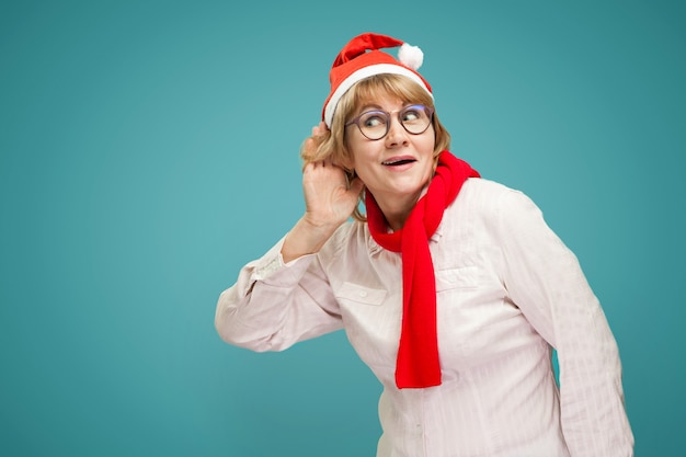 Christmas woman in shirt and jeans on blue background