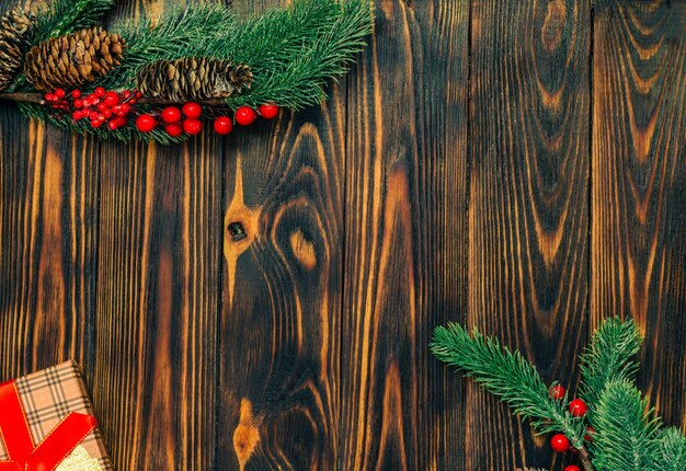 Christmas wooden background with fir branches and a place to copy.