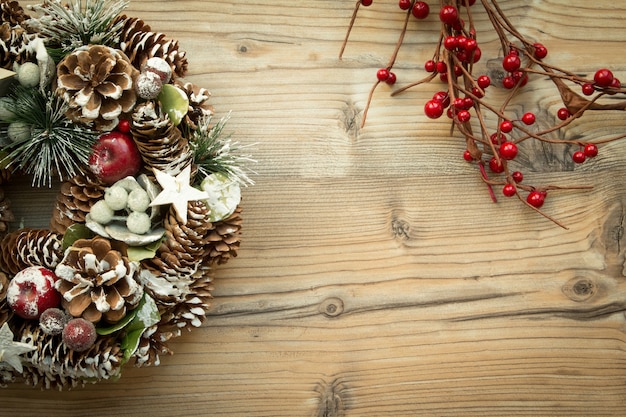 Christmas wreath and branch with red fruits