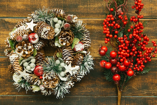 Christmas wreath and branch with red fruits