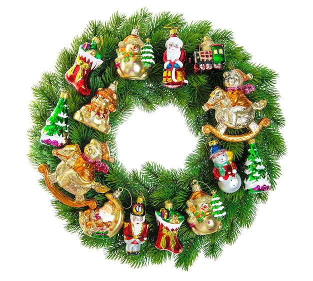 Christmas wreath decorated with ornaments baubles and vintage toys