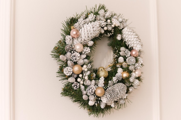 Christmas wreath made of spruce on a light background