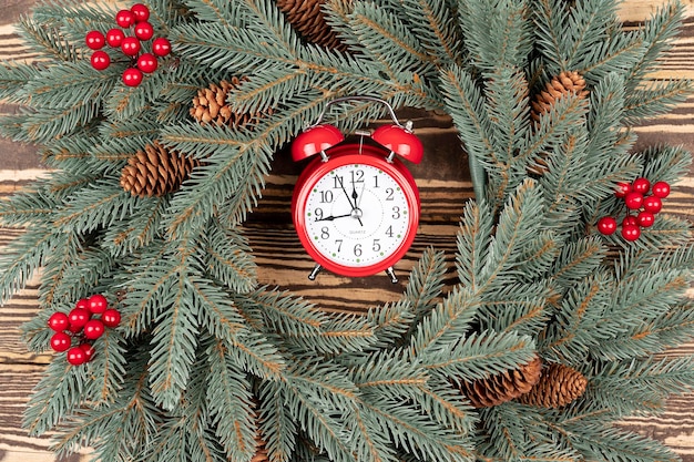 Christmas wreath and red alarm close up Christmas background with alarm Christmas shopping