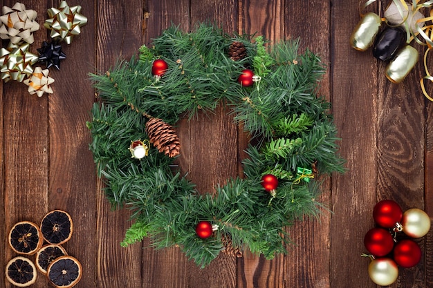 Christmas wreath on wooden background Mock up Greeting card