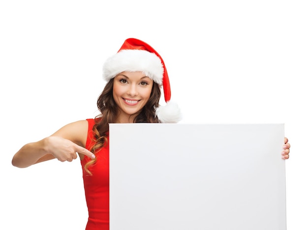 christmas, x-mas, people, advertisement, sale concept - happy woman in santa helper hat with blank white board