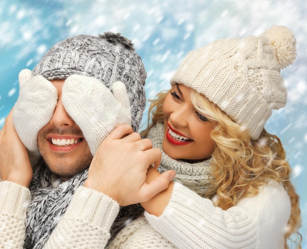 christmas, x-mas, winter, happiness concept - family couple in a winter clothes