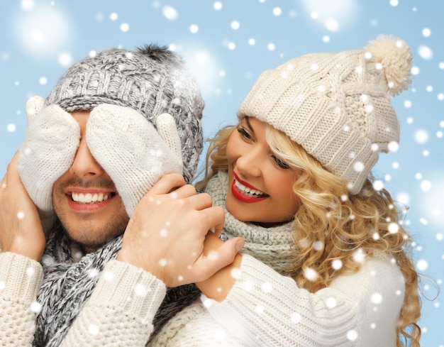 christmas, x-mas, winter, happiness concept - family couple in a winter clothes