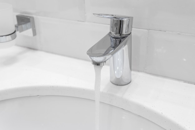 Chrome faucet in modern bathroom