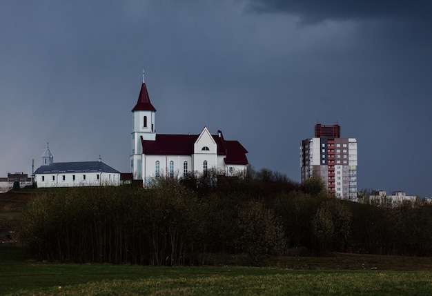 Church against a dark sky. Urban landscape, copy the space