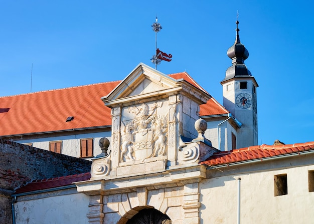 Church clock tower and entrance gate in Ptuj Castle in Slovenia. Architecture of Ptujski grad in Slovenija. Travel