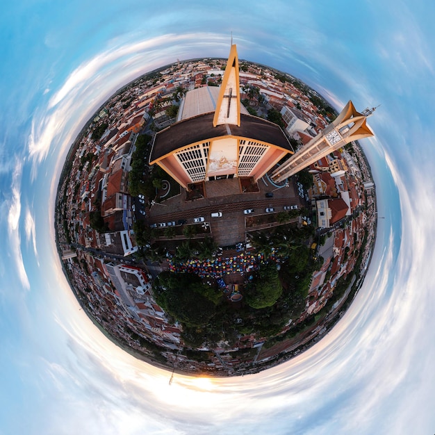 Photo church and clock tower with surrounding square in the city of bariri sp  small planet  drone view