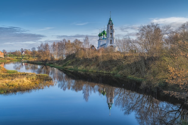 Church of the Holy Trinity in the village of Dievo Gorodishche. Early gloomy morning on the Bank of the Volga river in Yaroslavl region, Russia.