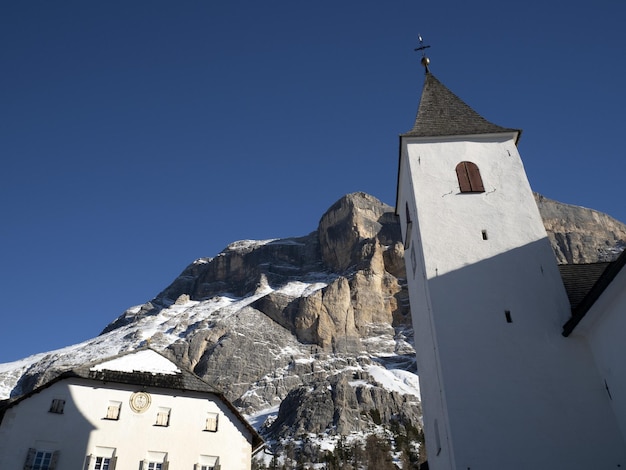 Church on Monte croce dolomites badia valley mountains in winter snow panorama