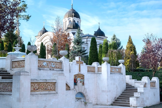 A church situatetd in the Curchi monastery. Stairs with wellspring and lush greenery. Good weather in Moldova