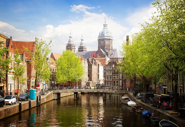 Church of St Nicholas, old town canal in Amsterdam, Holland, toned