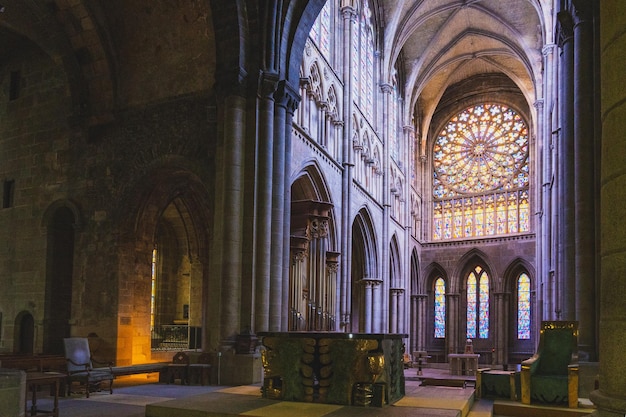 a church with a large stained glass window and a large stained glass window