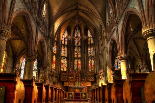 a church with a stained glass window and a stained glass window