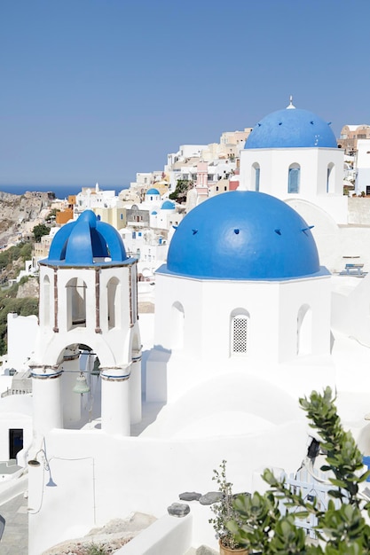 Churches with blue domes in Oia town on Santorini island Greece