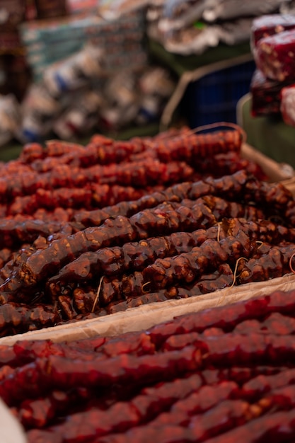 Churchkhela traditional Georgian delicacy. Churchkhela assortment on the market.