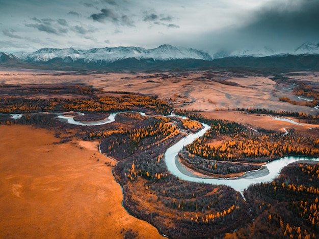 Chuya river with yellow autumn trees in Altai mountains Siberia Russia