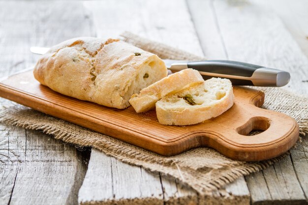 Ciabatta, wheat, rustic wood background