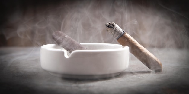 Cigar and ashtray on table Smoking