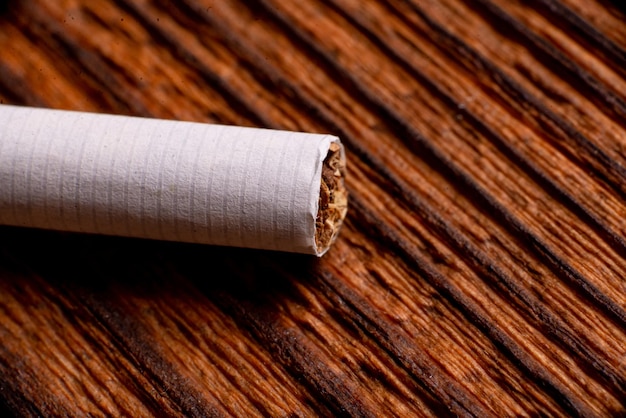 Cigarette close up on a wooden background