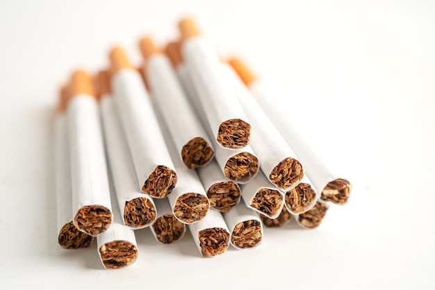 Cigarette tobacco in roll paper with filter tube isolated on white background No smoking concept