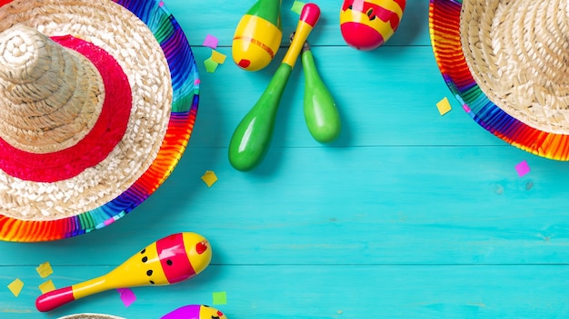 Cinco de Mayo holiday background made from maracas cactus and hat on yellow background Generative AI