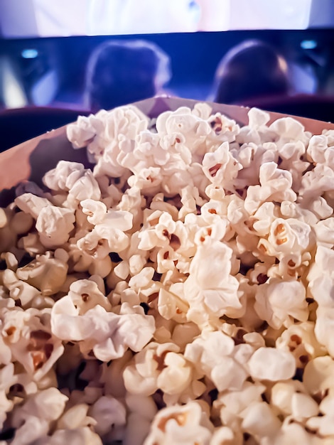 Cinema and entertainment popcorn box in the movie theatre for tv show streaming service and film industry production