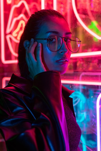 Cinematic night portrait of girl and neon lights