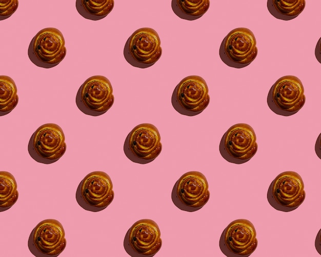 Cinnabon bun on pink background pattern