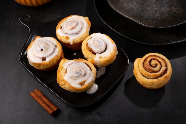 Cinnamon rolls on dark background