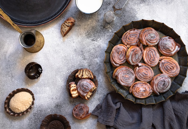 Cinnamon rolls with cream on a plate