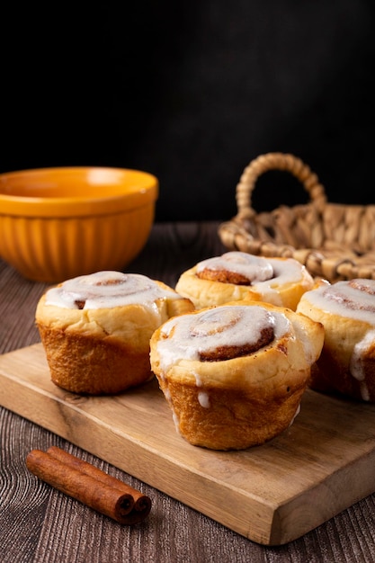 Cinnamon rolls on wooden background