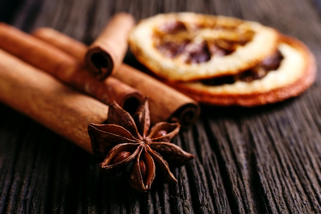 Cinnamon sticks, star anise and dried orange on the kitchen table