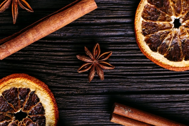 Cinnamon sticks, star anise and dried orange on the kitchen table