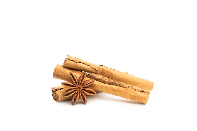 Cinnamon sticks and star anise on a white background with copy space