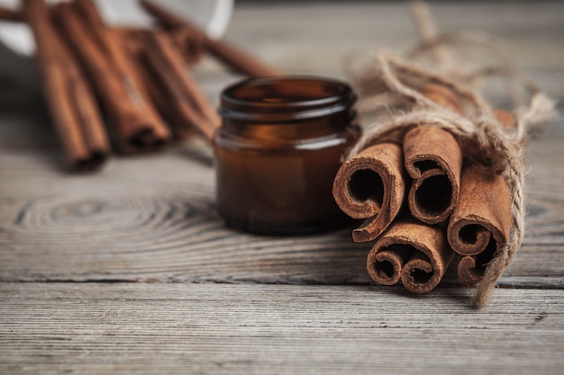 Cinnamon sticks on wooden background