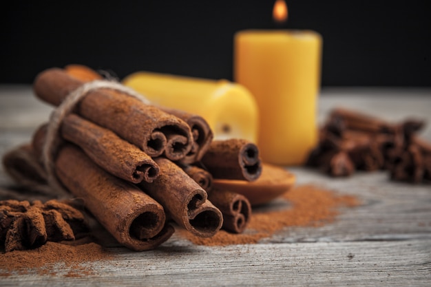 Cinnamon sticks on wooden table.