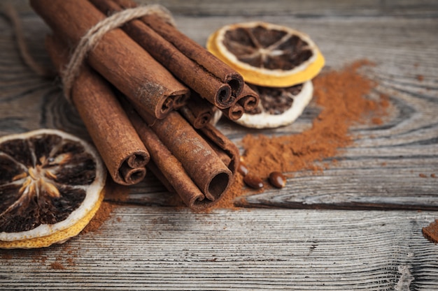 Cinnamon sticks on wooden table.