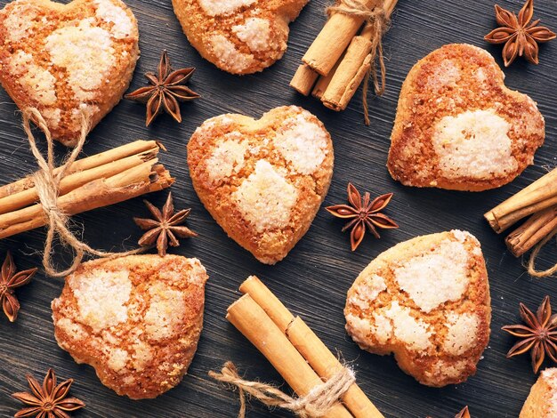 Cinnamon sugar biscuit hearts on a dark wooden background