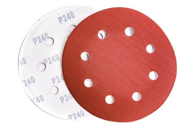 Circular sandpaper discs with 240 grit Velcro isolated on white background