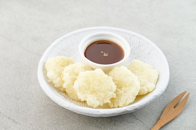 Cireng a savory snack from West Java Indonesia made from tapioca flour served with spicy sauce